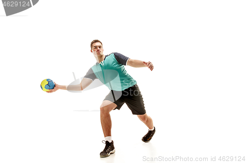 Image of The one caucasian young man as handball player at studio on white background