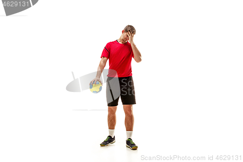 Image of The one caucasian young man as handball player at studio on white background