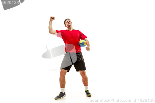 Image of The one caucasian young man as handball player at studio on white background