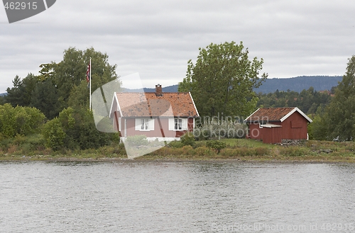 Image of Small cottage on a small island. 