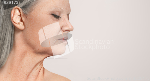 Image of Portrait of beautiful senior woman profile view