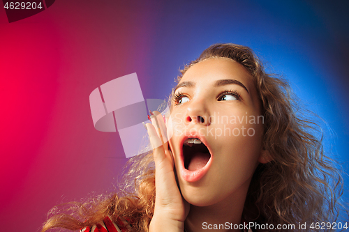 Image of Beautiful woman looking suprised