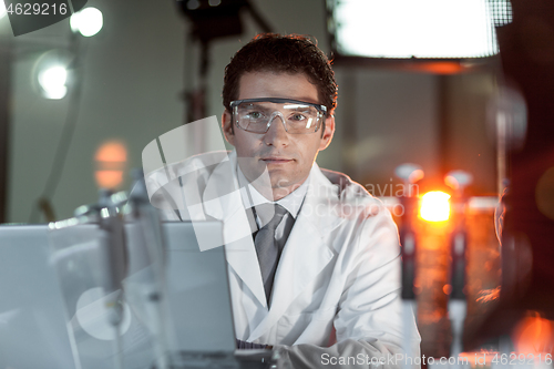 Image of Portrait of an engineer in his working environment.