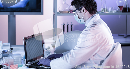 Image of Scientist working in corona virus vaccine development laboratory research facility.