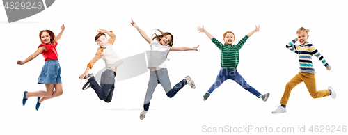 Image of happy children jumping over white background