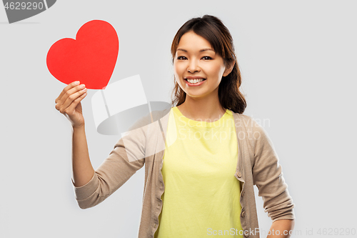 Image of happy asian woman with red heart