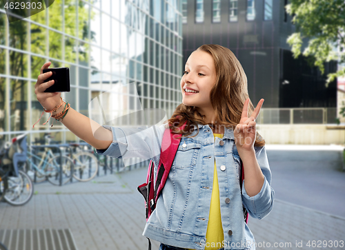 Image of teenage student girl taking selfie by smartphone
