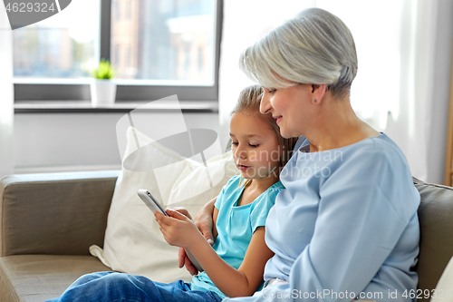 Image of grandmother and granddaughter with smartphone