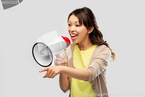 Image of asian woman speaking to megaphone