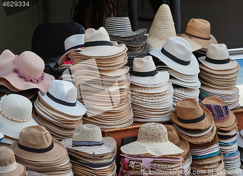 Image of Hats in piles on a market