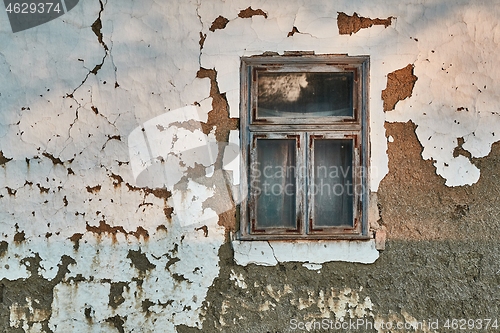 Image of Abandoned house collapsing adobe wall and window