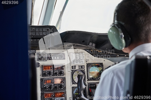 Image of Controlling a small aircraft in the flight deck