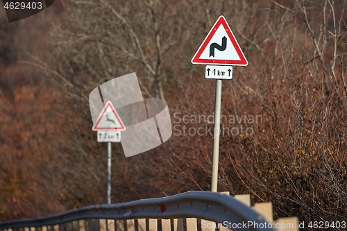 Image of Rural road traffic signs warning about bends