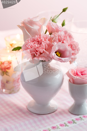 Image of Beautiful bouquet in pink and white on the kitchen table