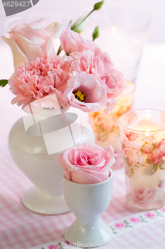 Image of Beautiful bouquet in pink and white on the kitchen table