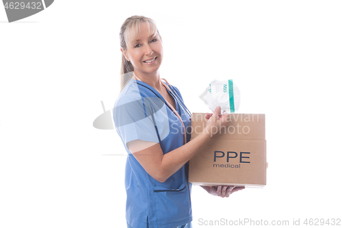 Image of Nurse holding a delivered box of much needed N95 medical masks