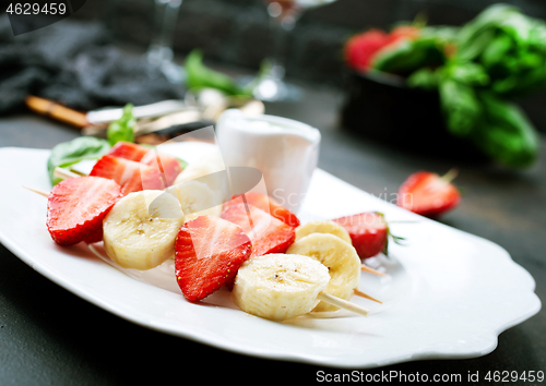 Image of banana with strawberry