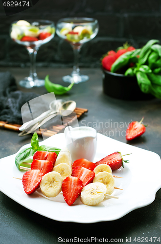 Image of banana with strawberry