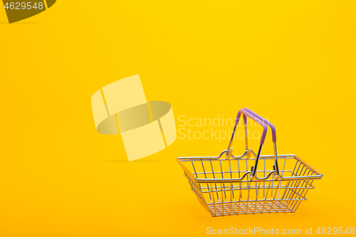 Image of Empty grocery basket on a bright orange background