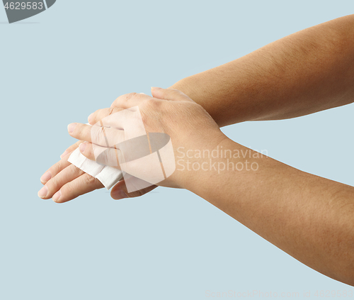 Image of hands are cleaned with a disinfectant wipe