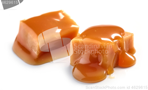 Image of caramel pieces on white background