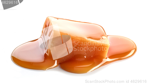 Image of melted caramel on white background