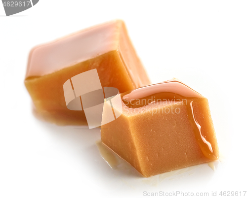 Image of caramel pieces on white background
