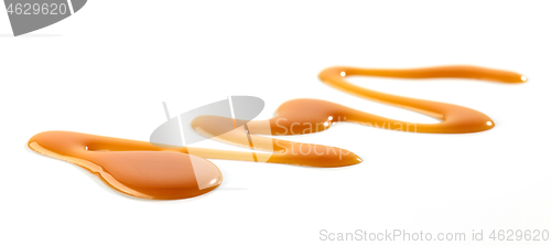 Image of caramel sauce on white background