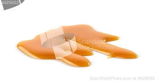 Image of caramel sauce on white background