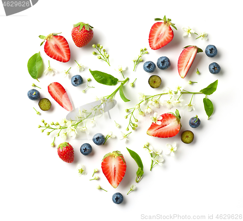 Image of heart shaped composition of flowers and berries