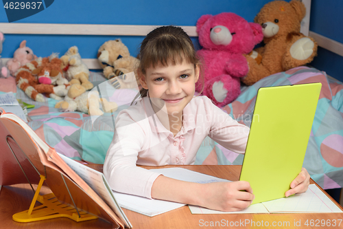 Image of Girl studying at school online at home.