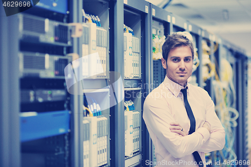 Image of young it engeneer in datacenter server room