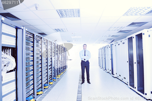 Image of young it engeneer in datacenter server room