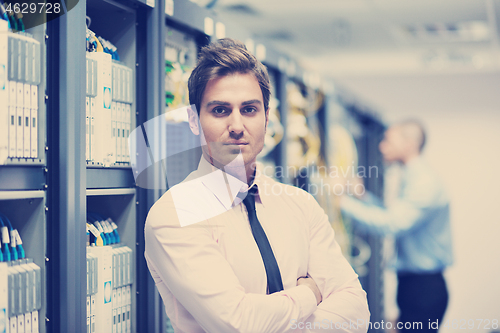 Image of it enineers in network server room