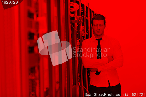 Image of young it engeneer in datacenter server room