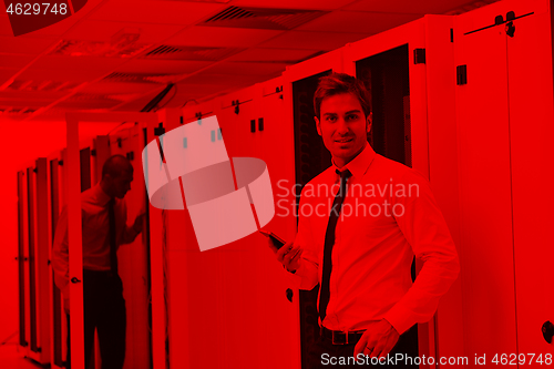 Image of it enineers in network server room