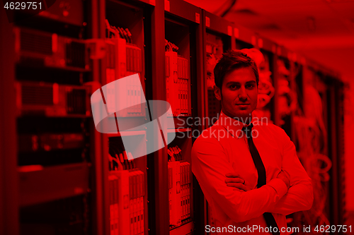 Image of young it engeneer in datacenter server room