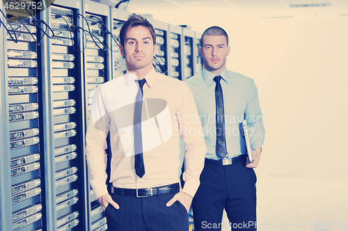 Image of it enineers in network server room