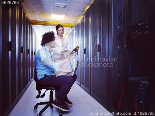 Image of technicians working together on servers