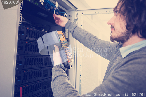 Image of technician using digital cable analyzer