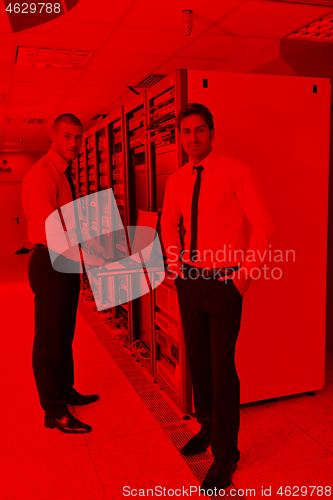 Image of it engineers in network server room