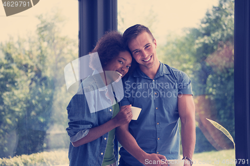 Image of romantic happy young couple relax at modern home indoors