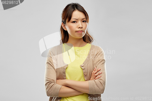 Image of displeased asian woman with crossed arms