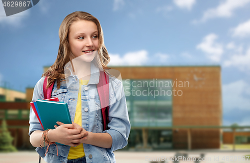 Image of happy smiling teenage student girl with school bag