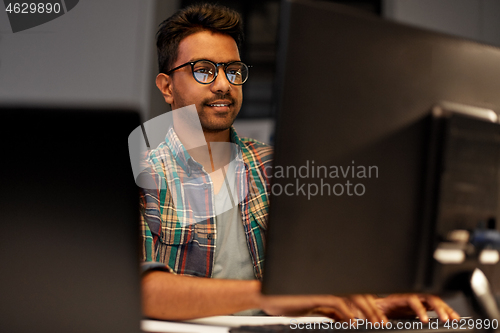 Image of close up of creative man working at night office