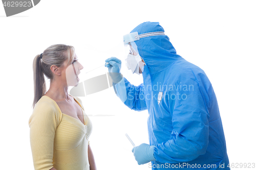 Image of Medical pathologist swabbing a patient for an infectious virus o