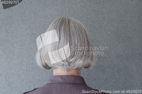 Image of Silver-haired lady on gray background