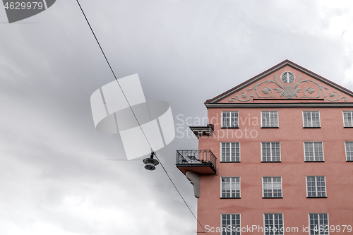 Image of Beautiful pink building and streetlight