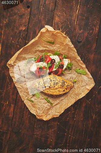 Image of Healthy food concept. Sandwiches with hummus, mozarella, tomato, black olives