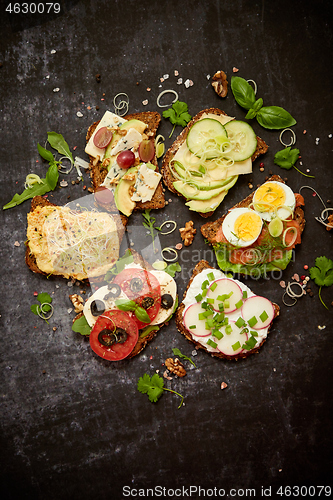 Image of Healthy vegan sandwiches made from homemade buckwheat bread with various toppings